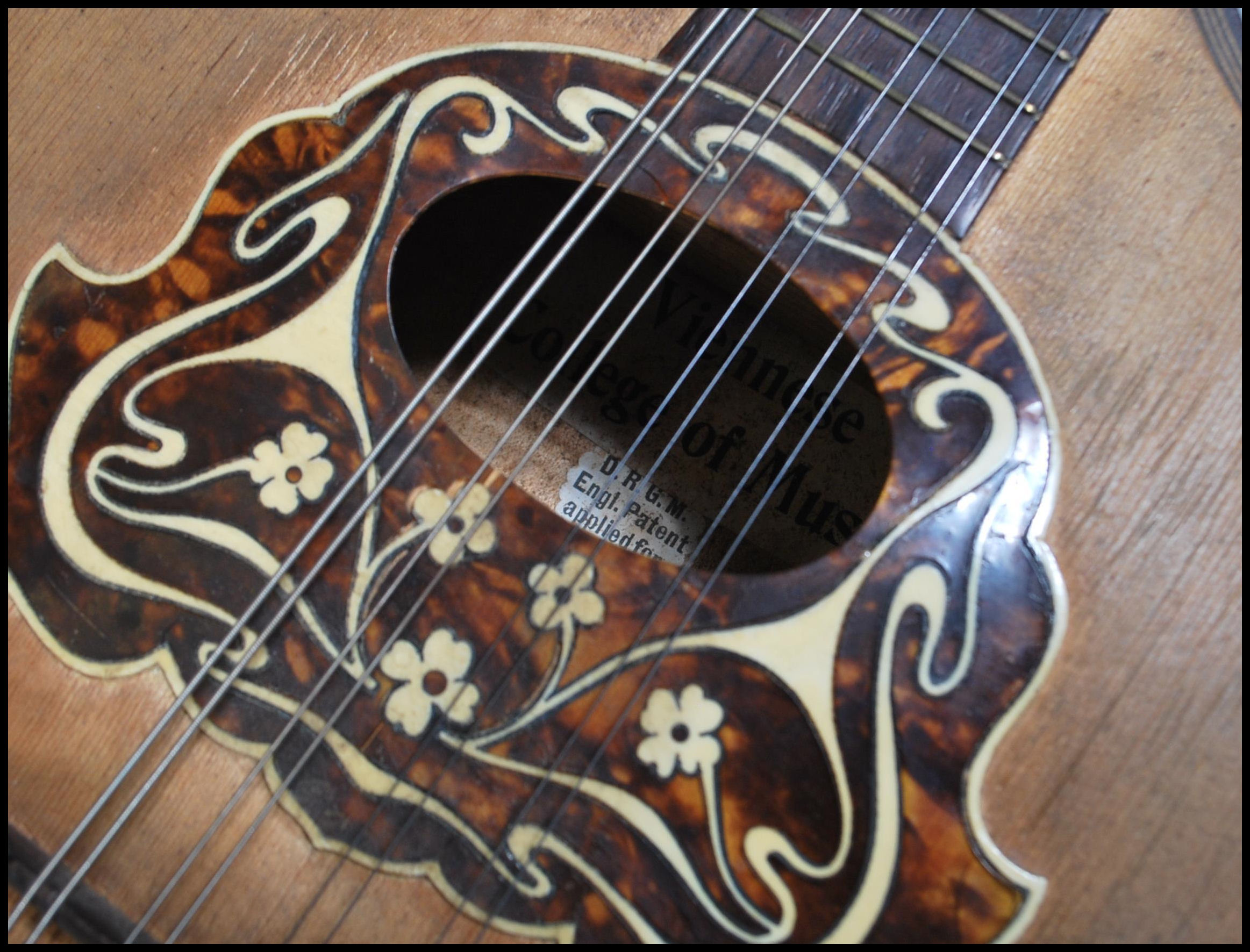 An early 20th Century Mandolin having mother of pearl inlaid fingerboard with bone and tortoiseshell - Image 6 of 7