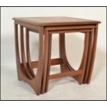 A 1970's G-Plan ' Astro ' teak wood nest of tables. The tables of graduating form with each being