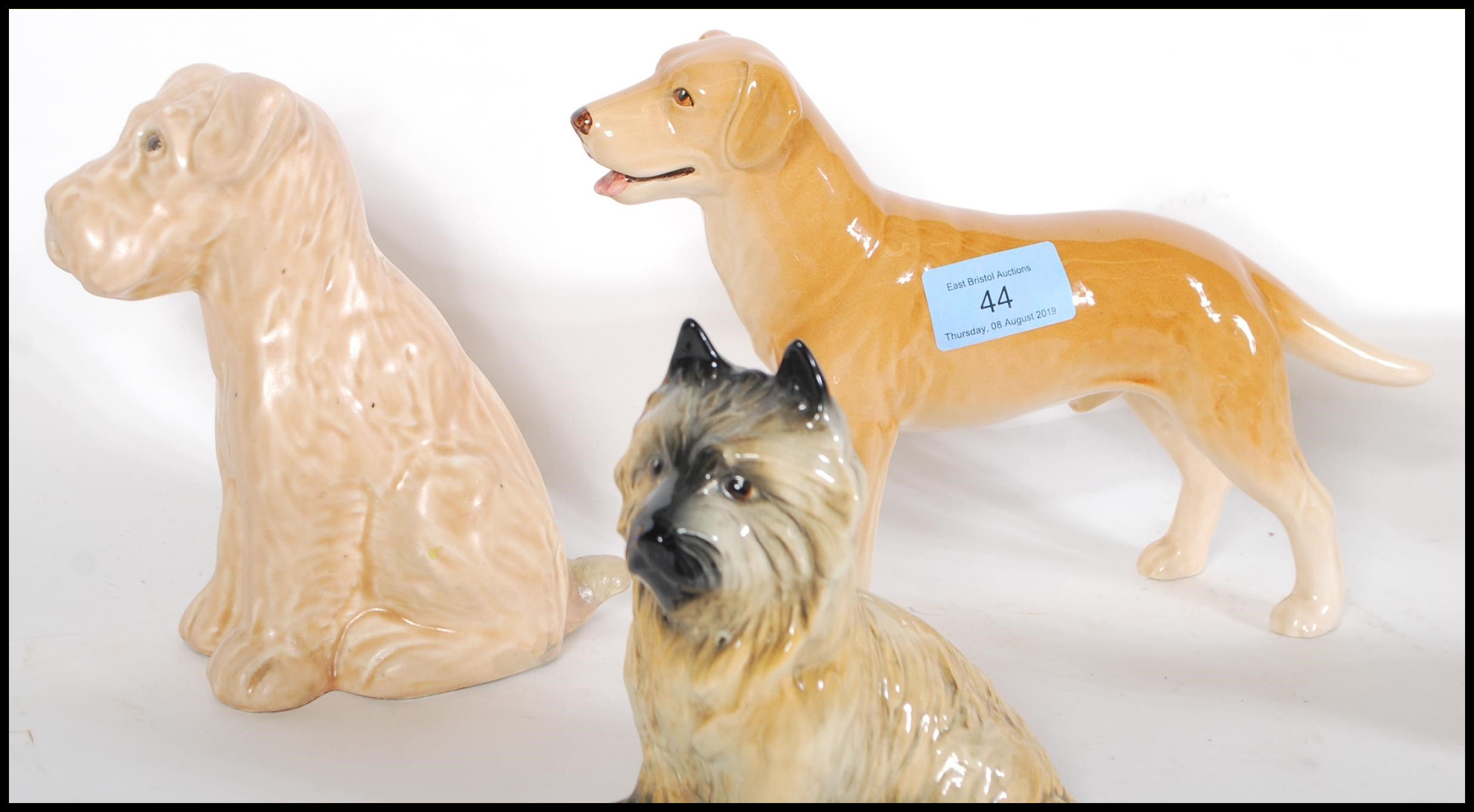 A collection of vintage 20th Century ceramic dog figurines by Sylvac to include a 1930's Terrier - Image 3 of 7