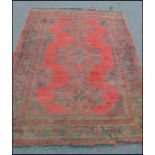 A 20th Century Persian Islamic hand made rug carpet having a large central panel with green