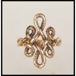 A 20th Century hallmarked 9ct gold ring having a knot design head. Hallmarked London 1972. Weight