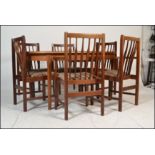 A mid century Danish inspired teak wood dining room suite to include an extending dining table