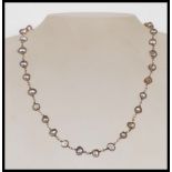 A silver hallmarked ladies grey baroque pearl cluster bracelet having a toggle clasp, along with a
