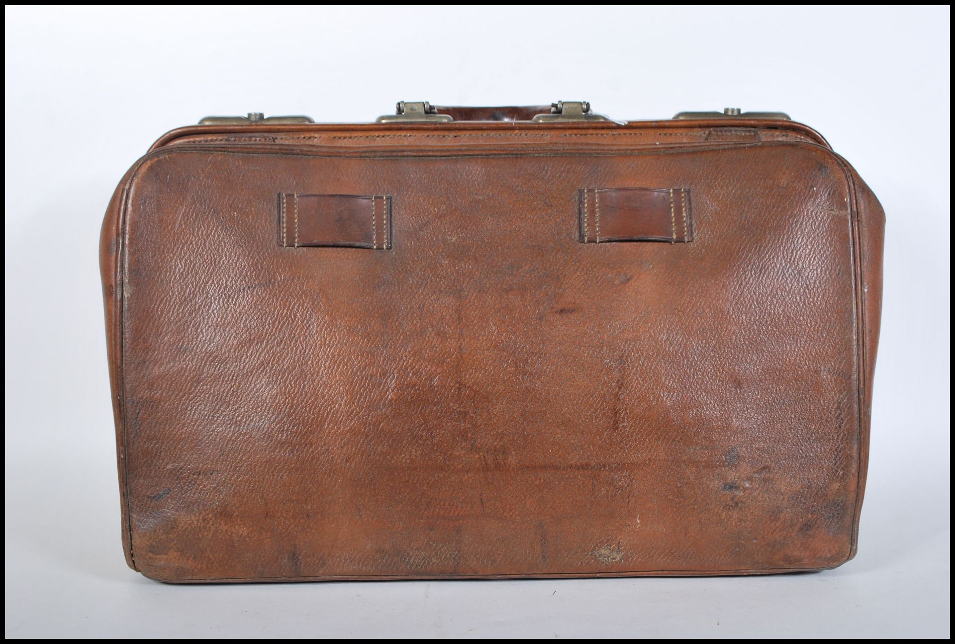A vintage mid 20th Century tan brown leather Gladstone / Doctors bag, carry handle atop with twin