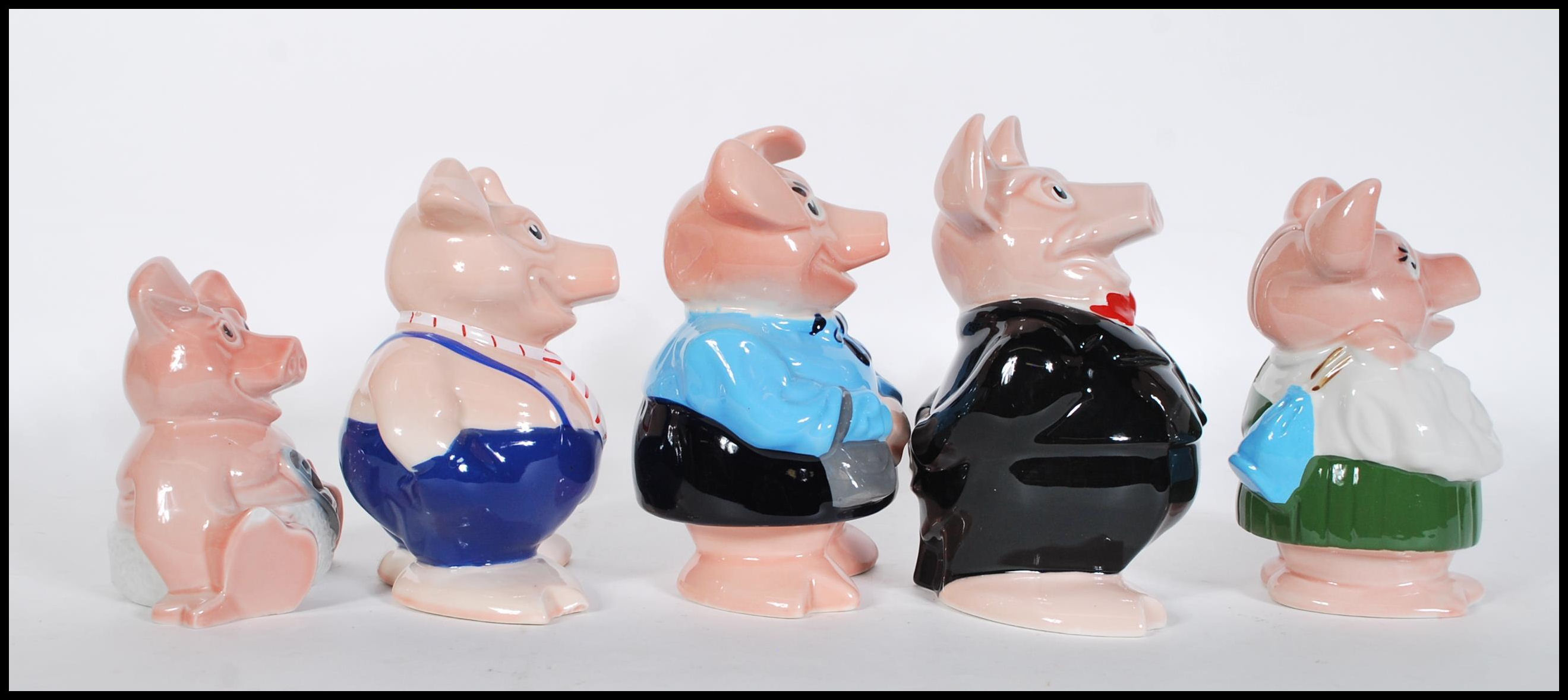 A set of five graduating 20th Century savers collectable Natwest pigs by Wade, fitted stoppers and - Image 2 of 6