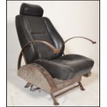 A retro 20th century car chair converted into a retro armchair in the manner of Ron Arad having