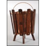 A 1960's retro vintage sputnik atomic teak wood and copper litter bin consisting of panelled teak