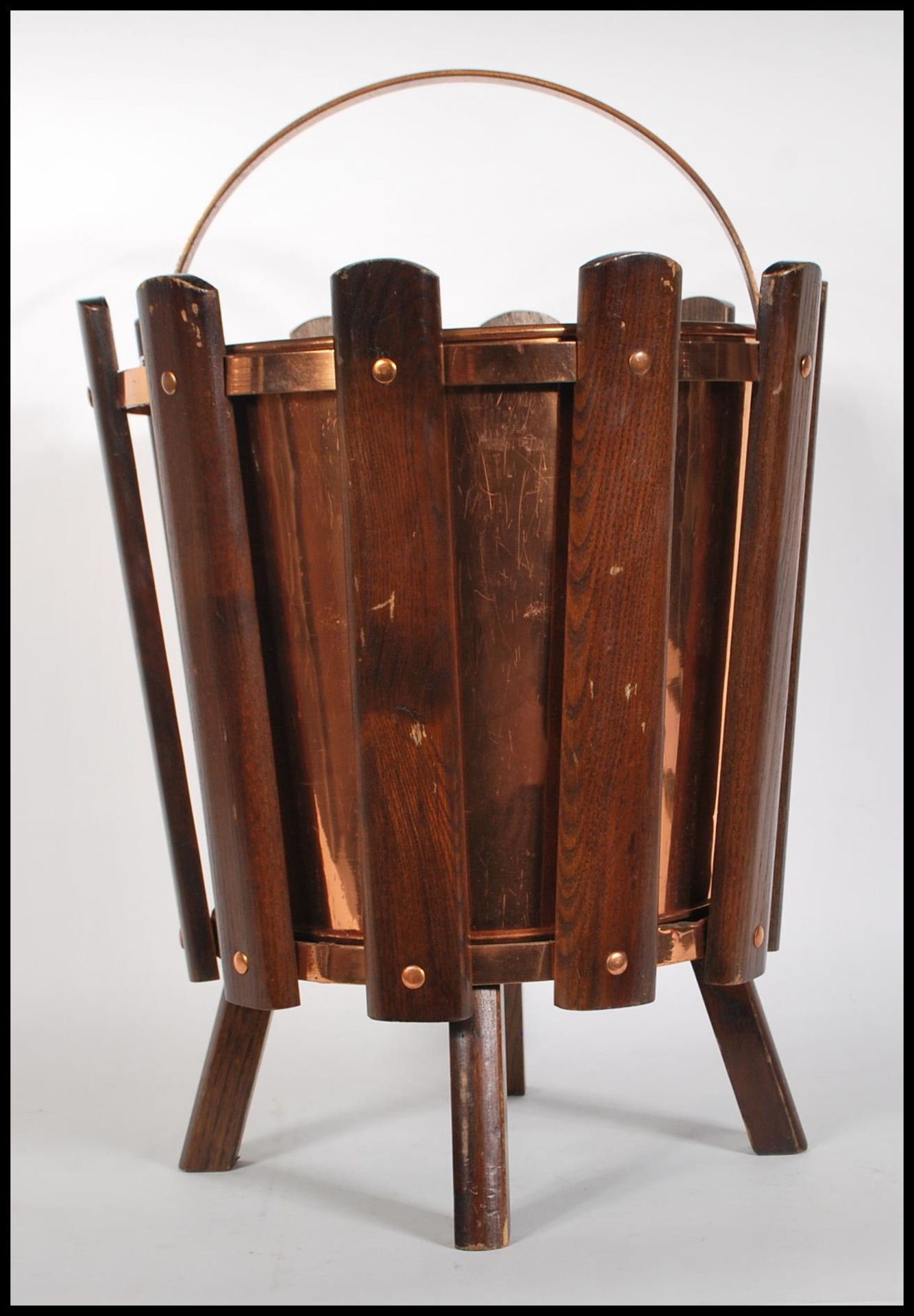 A 1960's retro vintage sputnik atomic teak wood and copper litter bin consisting of panelled teak