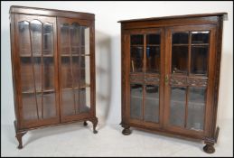 A 1930's Queen Anne oak china display cabinet raised on cabriole legs with claw and ball feet. Above