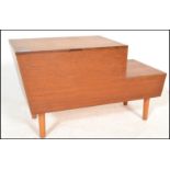 A retro 20th Century teak wood stepped work box / sewing box, harry handle to top hinged top with