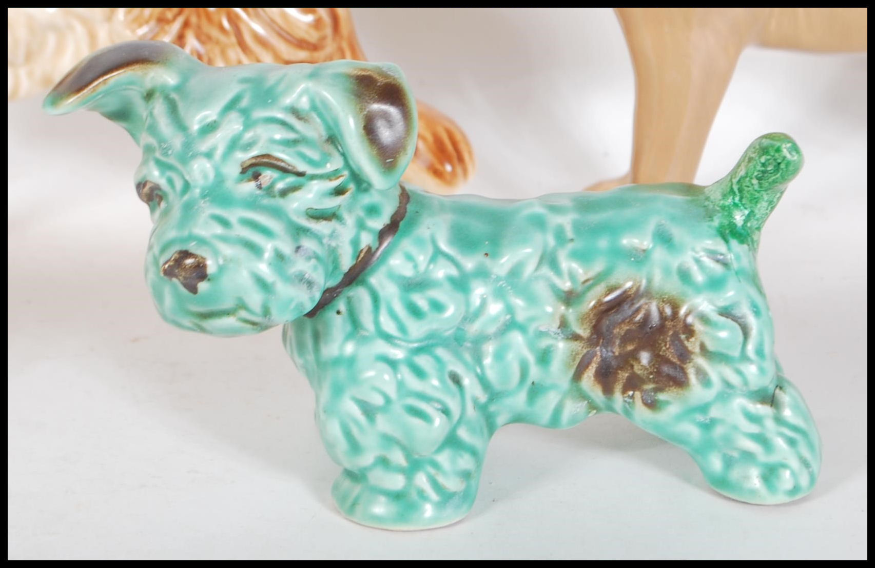 A collection of vintage 20th Century ceramic dog figurines by Sylvac to include a 1930's Terrier - Image 6 of 7