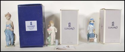 A collection of three Lladro ceramic figurines to include Spring 5217, Winter 5220 and Pocket Full