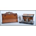 A Victorian mahogany and ebony flash worked desk tidy and inkwell combination having pigeon hole box