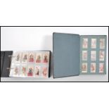 A collection of vintage cigarette cards across two albums to include full and parts sets; Ringer's