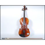 An early 20th Century Continental violin, the two piece back of faint medium curl with similar