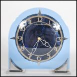 A early 20th Century Art Deco blue glass and chrome mantel clock having pierced Arabic numeral