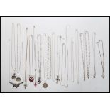 A selection of stamped 925 necklace chains and pendants to include a crucifix pendant set with a