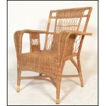 An early to mid century bamboo / whicker rattan weave plantation chair. Swept arms with a pierced