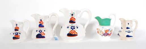 A collection of 19th century Hydra jugs  to include a graduating set of 3 with Imari style