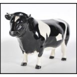 A 20th Century Beswick ceramic figurine of  CH Coddington Hilt bar bullock. Length 20 cm Stamped