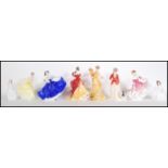 A collection of Royal Doulton ceramic figural ladies to include Elaine HN 2791, Figure of The Year