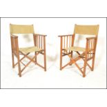 A group of four retro mid 20th Century wooden and canvas upholstered directors / garden chairs,