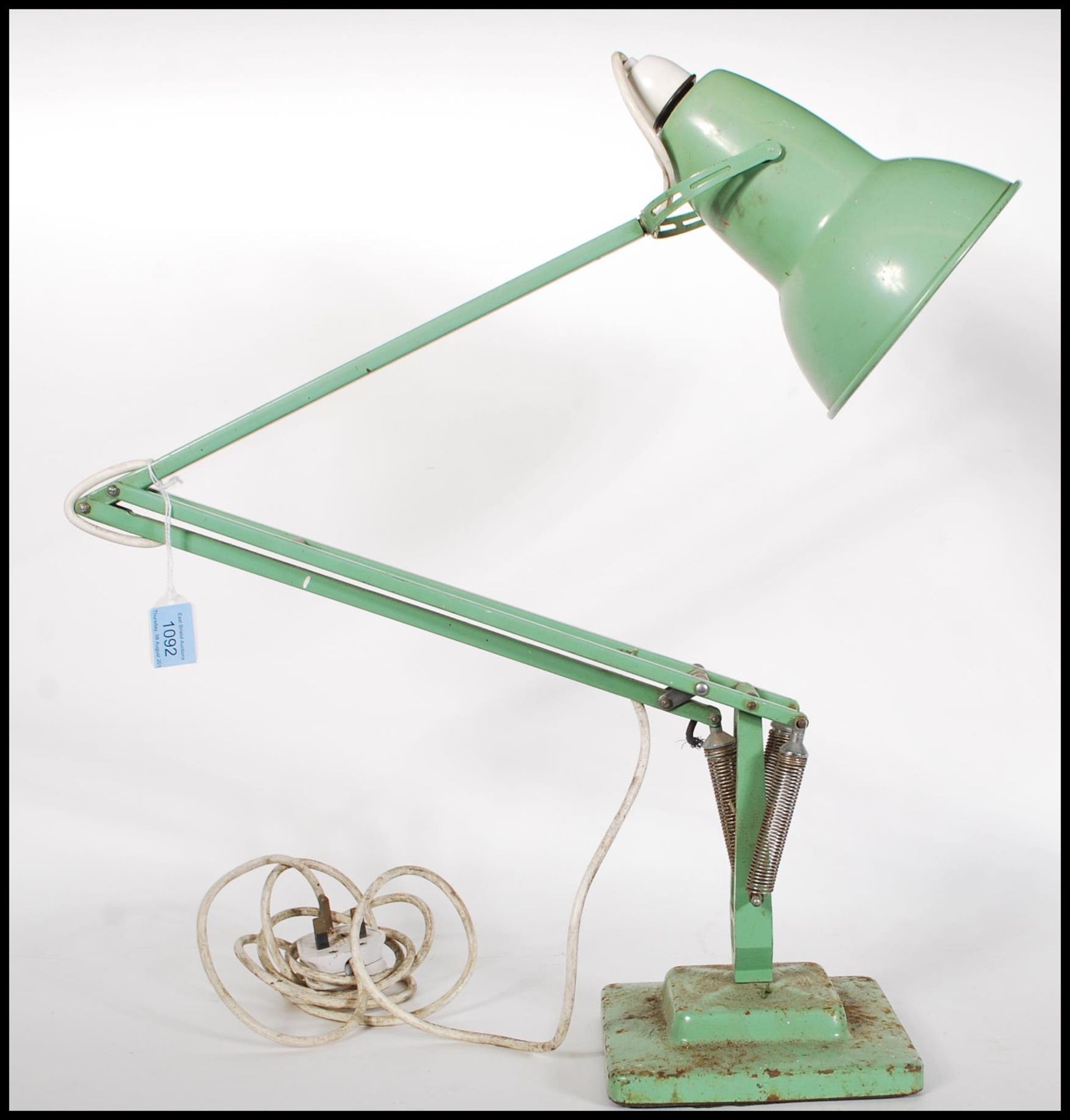 A vintage early 20th century retro industrial two step Herbert Terry angle poise lamp light in a