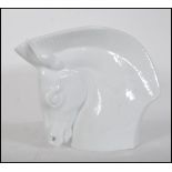 A large Royal Worcester Porcelain Art Deco style vase in the form of a stylised horse's head and