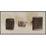 Two silver hallmarked vesta cases dating from the 19th Century, one having engine turned