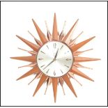 An original retro vintage 1970's Metamec sunburst wall clock having Arabic and batten numerals to