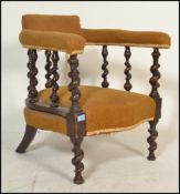 A Victorian barleytwist armchair raised on bobbin turned legs with yellow velour seat and elbow