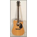 A 20th Century Electro acoustic six string guitar, Model MF / CAE. Mother of pearl inlaid fret