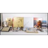 A collection of Elvis Presley related music memorabilia to include a vinyl record box set, tape