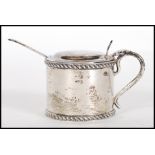 A late Victorian silver hallmarked table condiment pot with blue glass liner. Hallmarked for