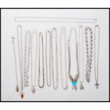 A group of silver necklaces to include a multi chain necklace set with a turquoise stone cabochon, a