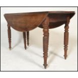 A 19th century French fruit wood drop leaf dining