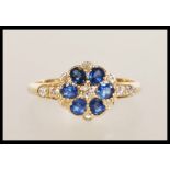 AN 18ct GOLD SAPPHIRE AND DIAMOND RING