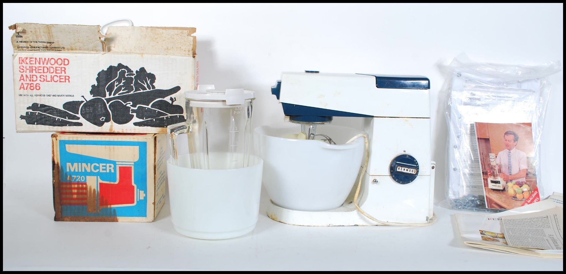 A mid century Kenwood Chef kitchen mixer complete with the K whisk along with other Kenwood