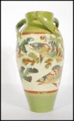 William Baron for CH Brannam Pottery 1891. A tall three handled vase of bulbous form with waisted