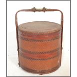 A vintage 20th Century Chinese bamboo woven lacquered and brass bound wedding food storage pot,