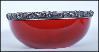 A 20th century Royal Doulton large red flambe glaze circular bowl applied with a silver hallmarked