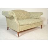 A good Regency style upholstered two seat sofa settee. Raised on turned legs with flared arms and