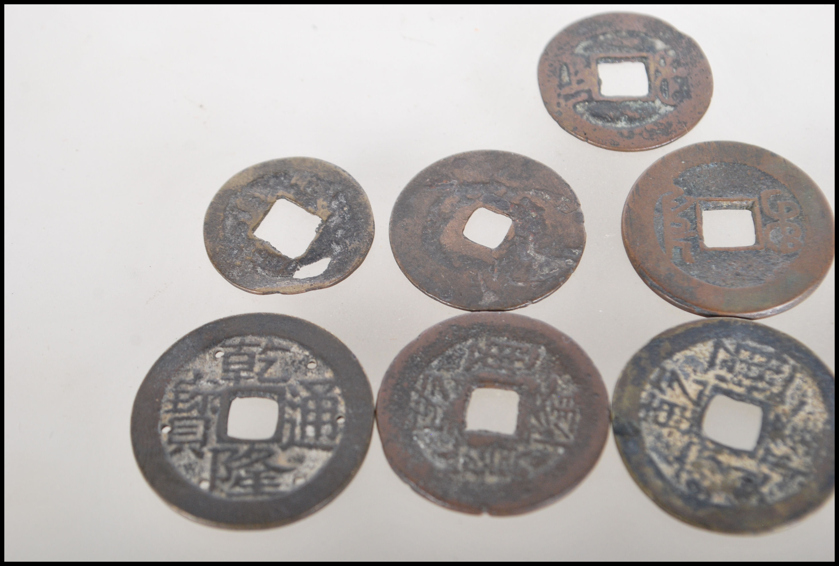A group of nine Chinese tang dynasty coins having square pierced centres. Nine in total. - Image 3 of 7