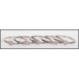 A group of five silver hallmarked bangles, each bangle having Celtic knot decoration. Hallmarks