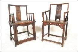A pair of believed 19th / 20th century Chinese armchairs / elbow chairs. One having solid seat pad