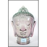 A vintage retro 20th Century glass Buddha head featuring beaded head dress with moulded features.