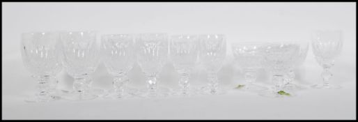 A collection of mixed cut glasses by Waterford Crystal having round faceted cut stems raised on