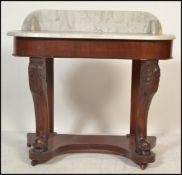 A Victorian 19th century mahogany and marble duchess console table. Raised on bun feet with lower