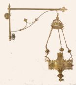 A 19th Century Gothic brass wall light with original bracket having Gothic pierced fretwork and