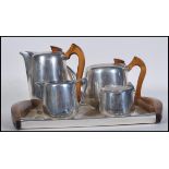 A vintage retro mid 20th Century five piece stainless steel Piquet Ware coffee service consisting of